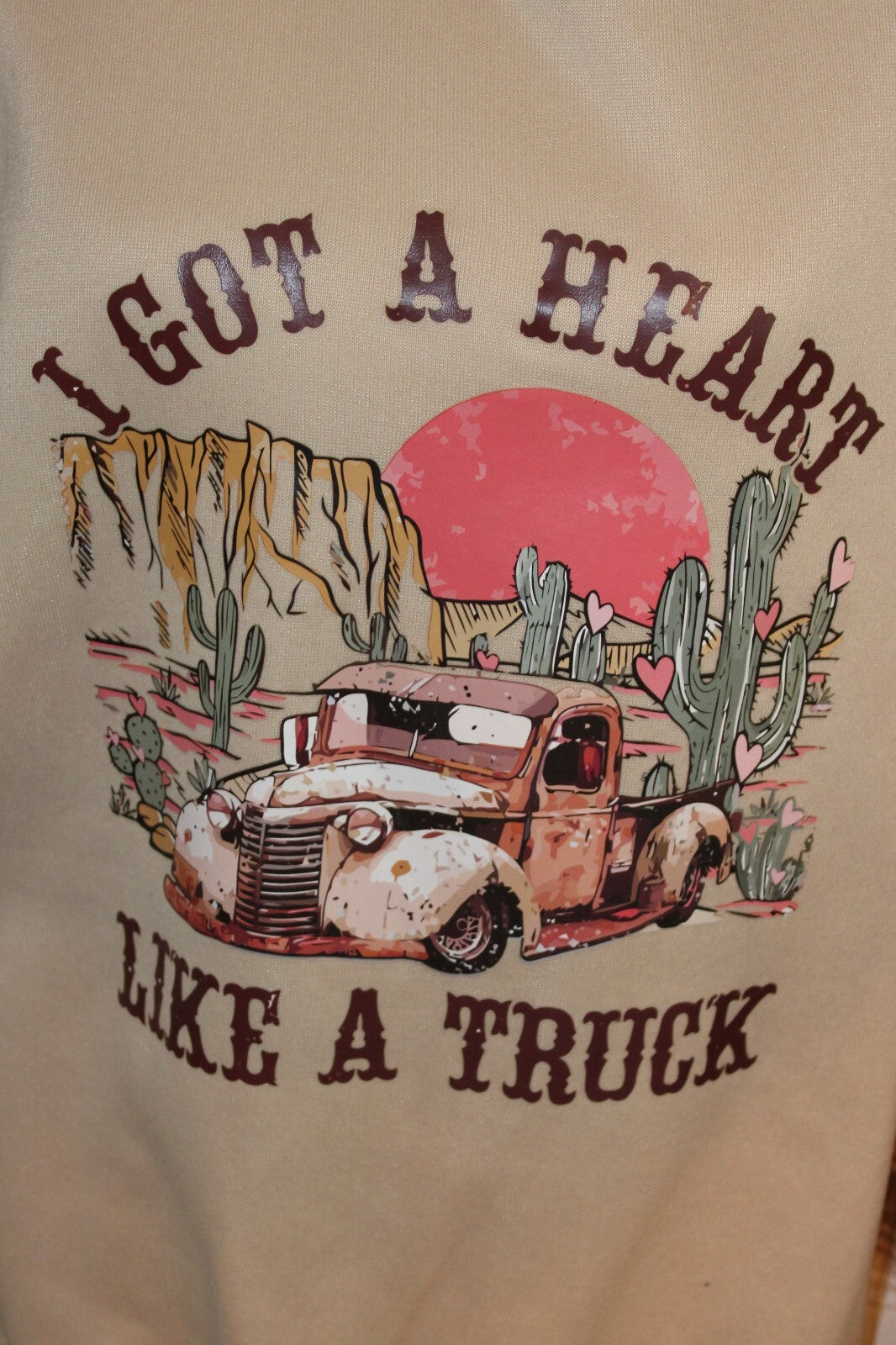 Vintage Style Beige Sweatshirt with Plaid Sleeves and Retro Truck Graphic