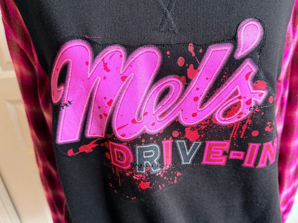 HHN Mel's DIVE-In Black Sweatshirt with Pink Plaid Sleeves and Graphic Print, Size Medium (TTS)