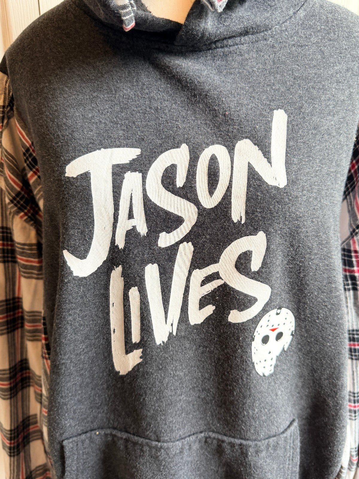 Jason Lives Graphic Hoodie with Plaid Sleeves and Hooded Collar.